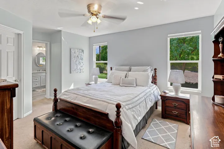 Ceiling fan with integrated lighting, two windows with natural light