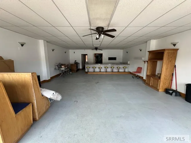 Spacious open layout featuring recessed ceiling lights and ceiling fans