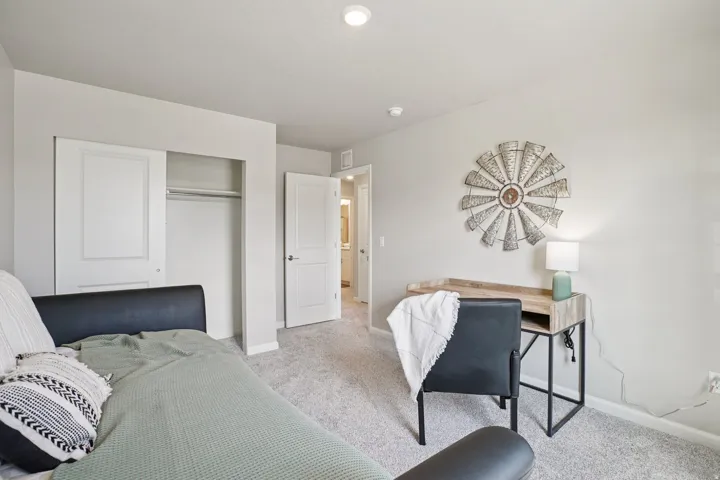 Plush carpeting, recessed lighting, and a sliding-door closet