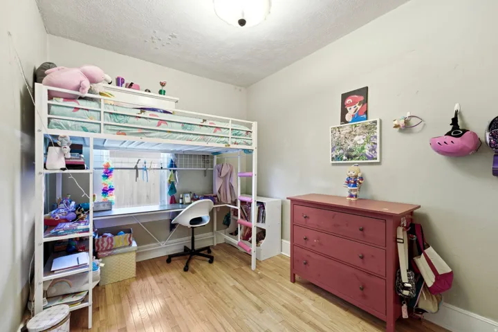 Hardwood flooring, light wall tones, and overhead lighting