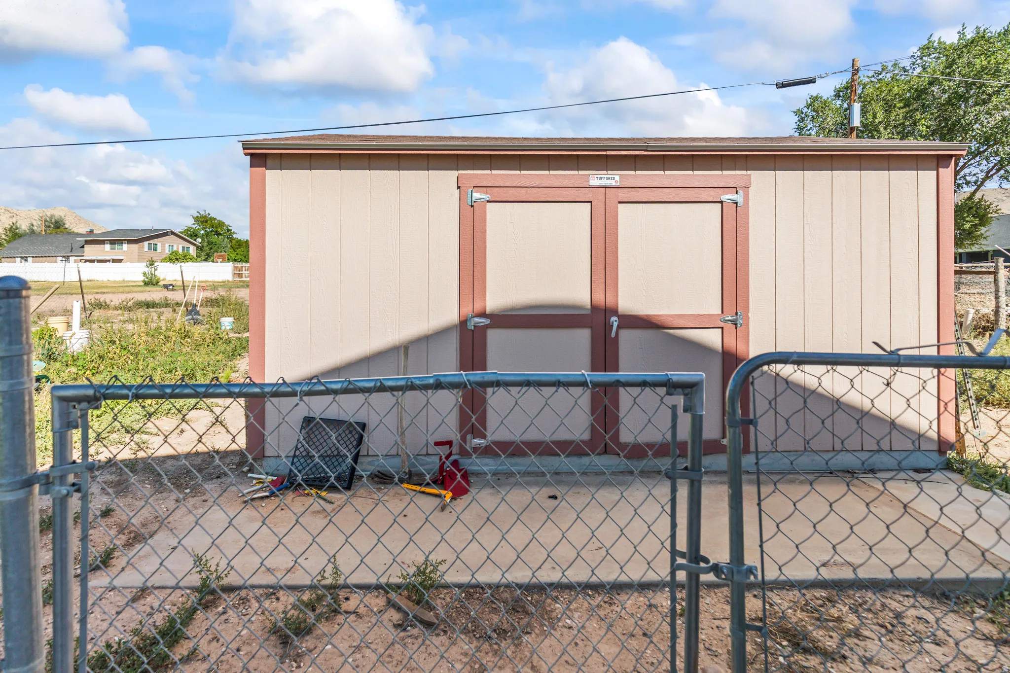 Detached shed with double doors and a gable roof