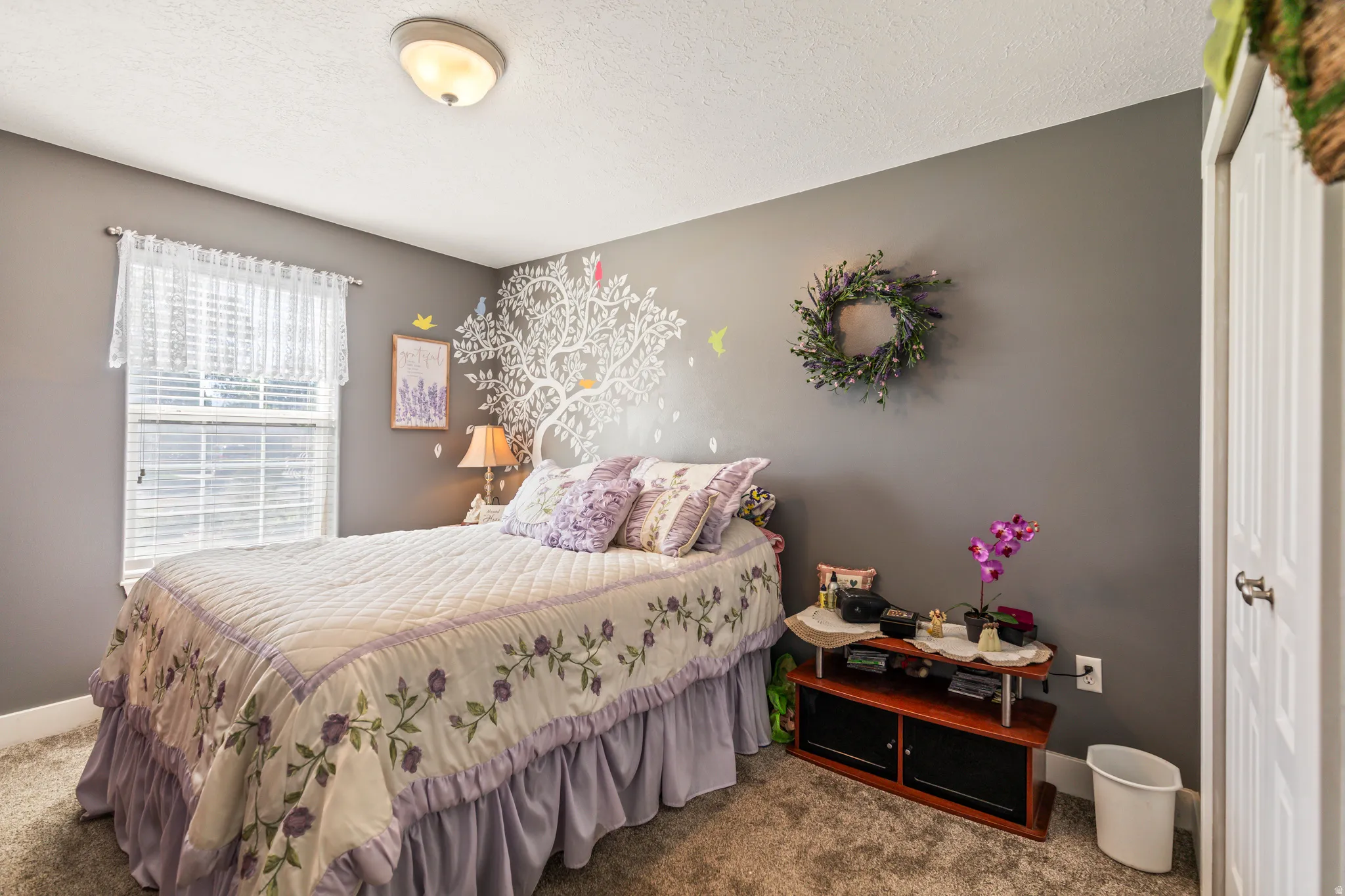 Wall-to-wall carpeting and a ceiling-mounted light fixture