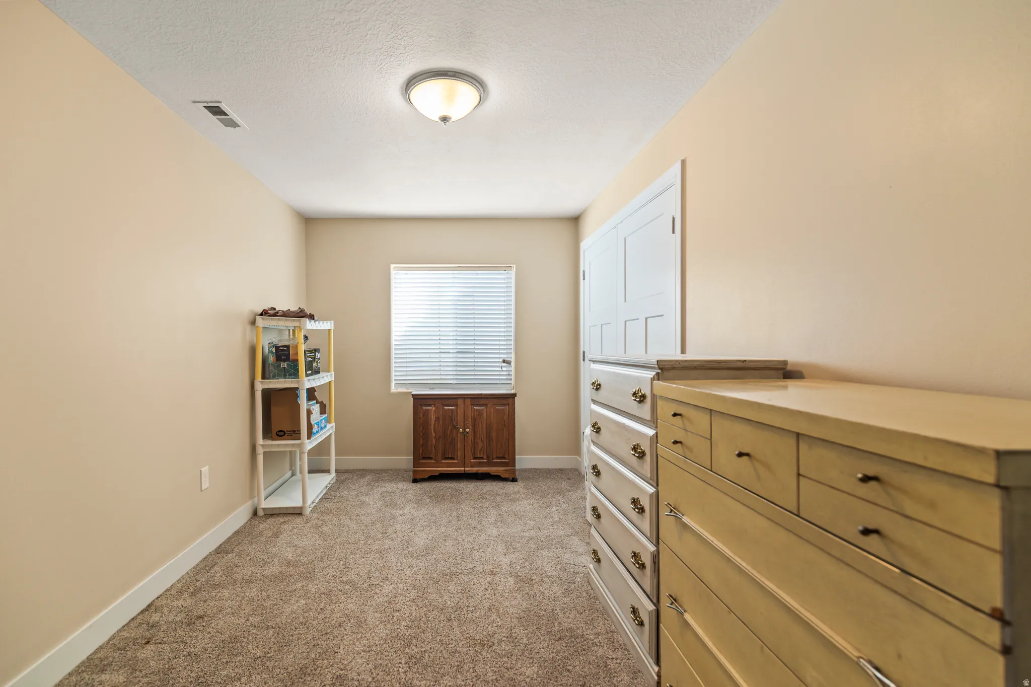 Wall-to-wall carpeting and neutral wall tones