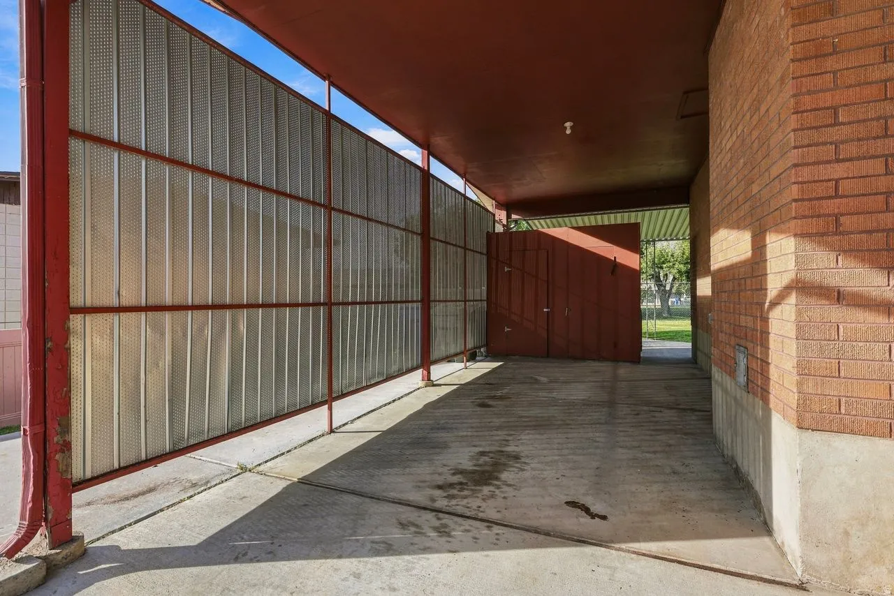 Oversized carport with 220V power to charge an electric vehicle
