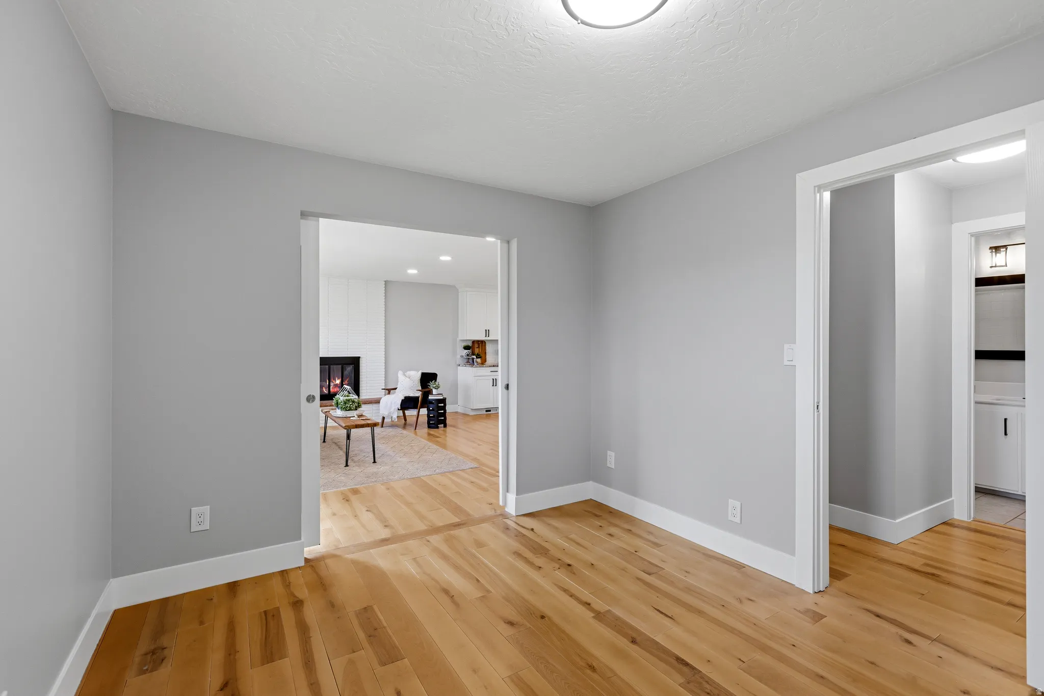 Flex space could be used as a bedroom, den or office.  Seller is willing to add the wall back in if desired.