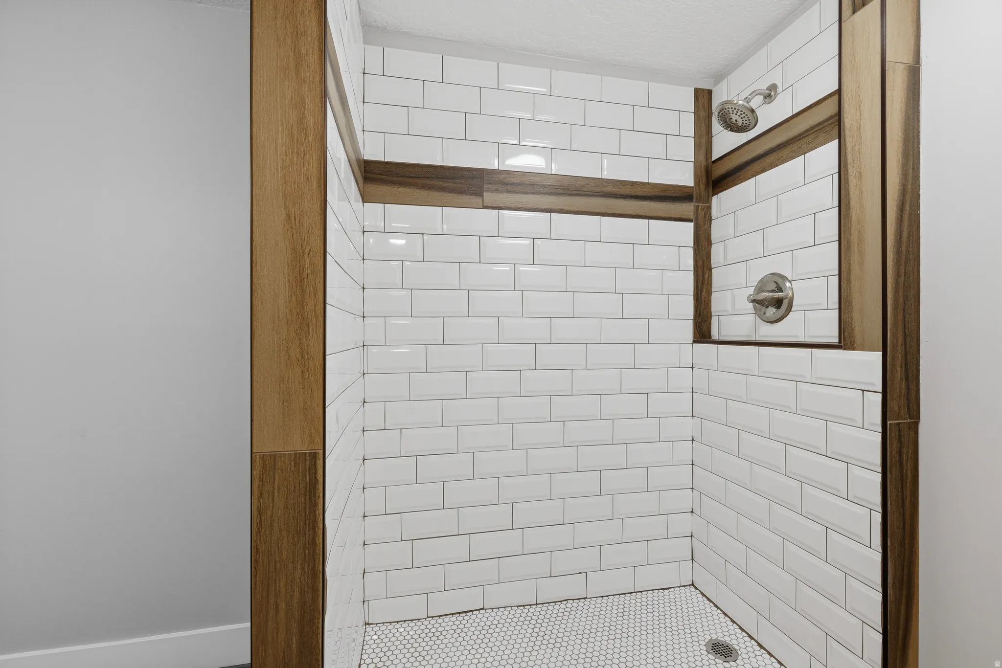 Updated lower level bathroom with large vanity and updated shower