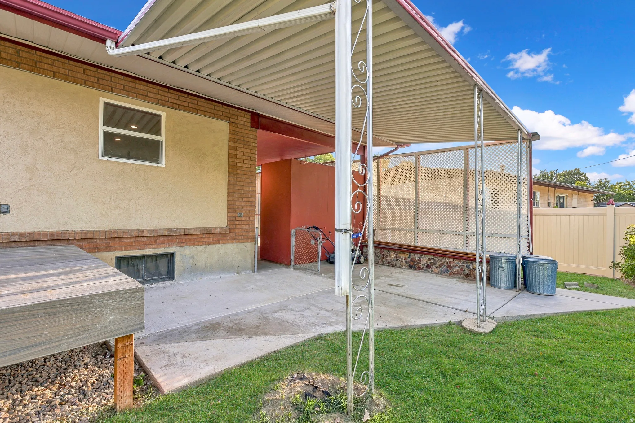 Covered patio with room for a dining table, BBQ grill and plenty of friends and family.  Photo taken before deck was finished.