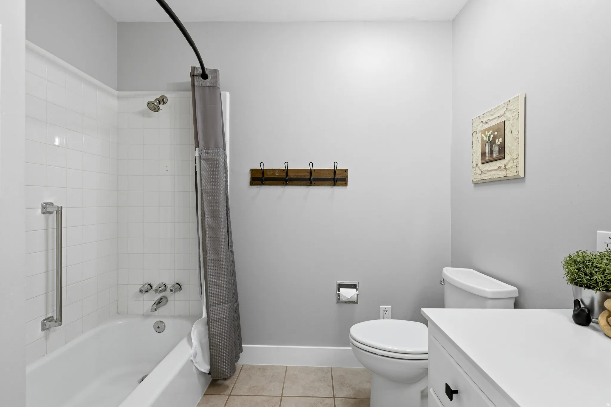 Updated main floor bathroom with large vanity, full sized shower and fresh neutral paint