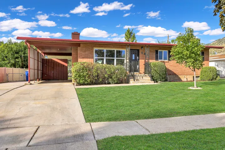 Charming rambler featuring low maintenance brick, brand new shutters and unpdated windows
