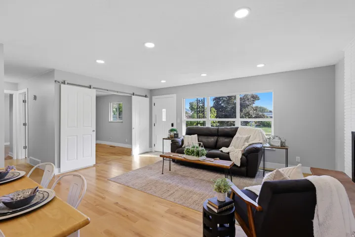Open floor plan, huge updated windows, hardwood flooring, and fresh neutral paint