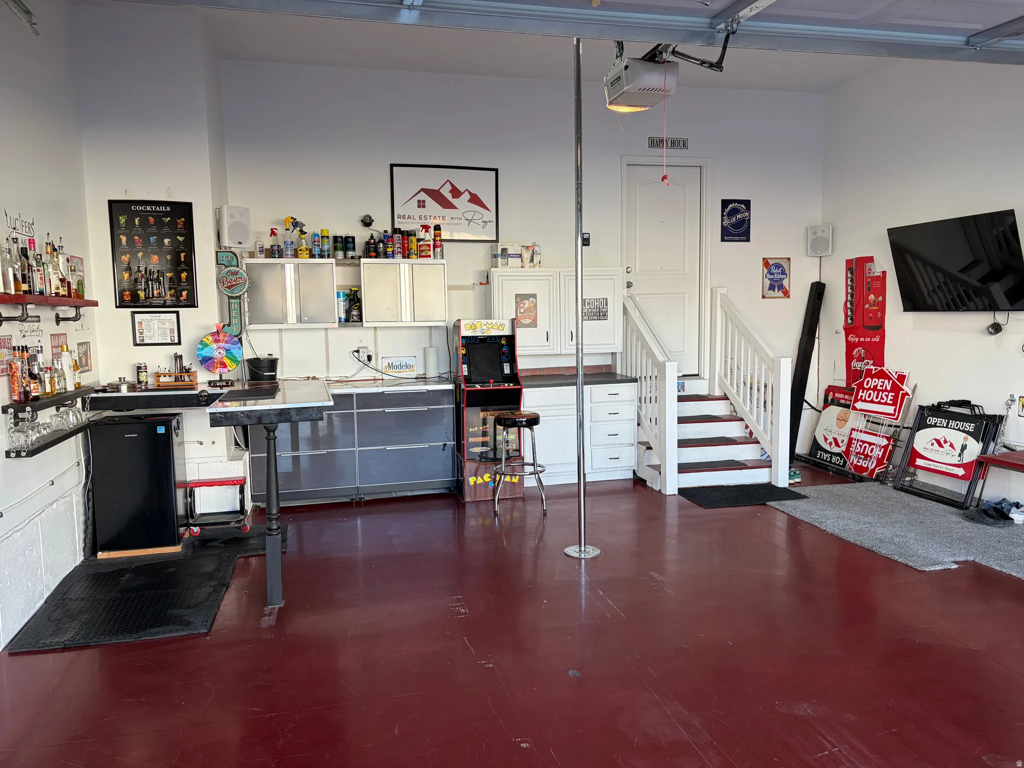 Garage by Day.  Party by Night!  Flip Up Convertible Bar, Mini Fridge, Pac Man Video Arcade Game, 60" TV, Dart Board, Removable Dance/Fitness Pole, Custom Flip Up Bench Seating, Lights, Speakers, Storage Cabinets and Decor, plus an EV Plug and Mounted Ret