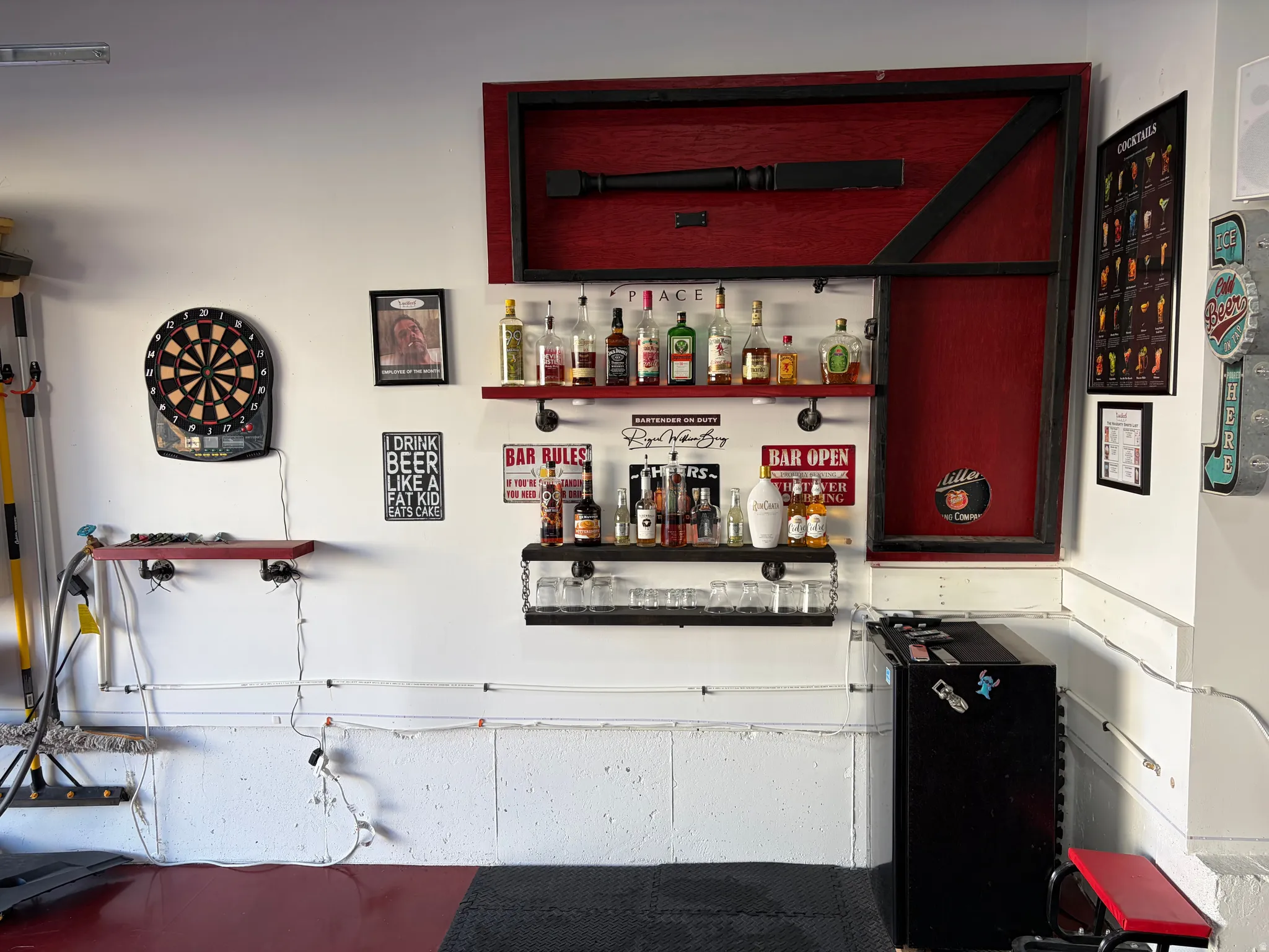 Garage by Day.  Party by Night!  Flip Up Convertible Bar, Mini Fridge, Pac Man Video Arcade Game, 60" TV, Dart Board, Removable Dance/Fitness Pole, Custom Flip Up Bench Seating, Lights, Speakers, Storage Cabinets and Decor, plus an EV Plug and Mounted Ret