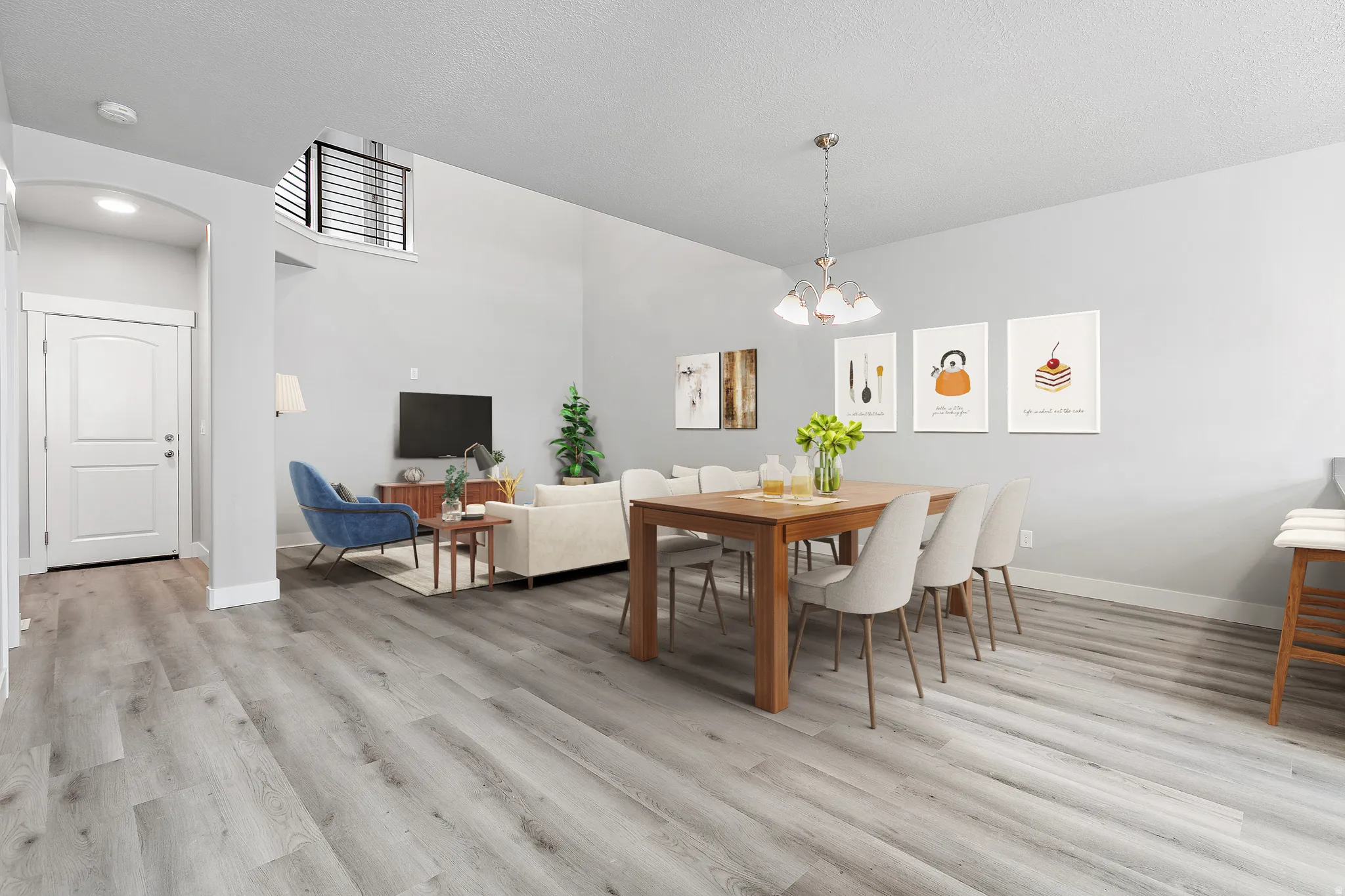 Open-concept living and dining area featuring wood-finish flooring, high vaulted ceilings, and an arched entry