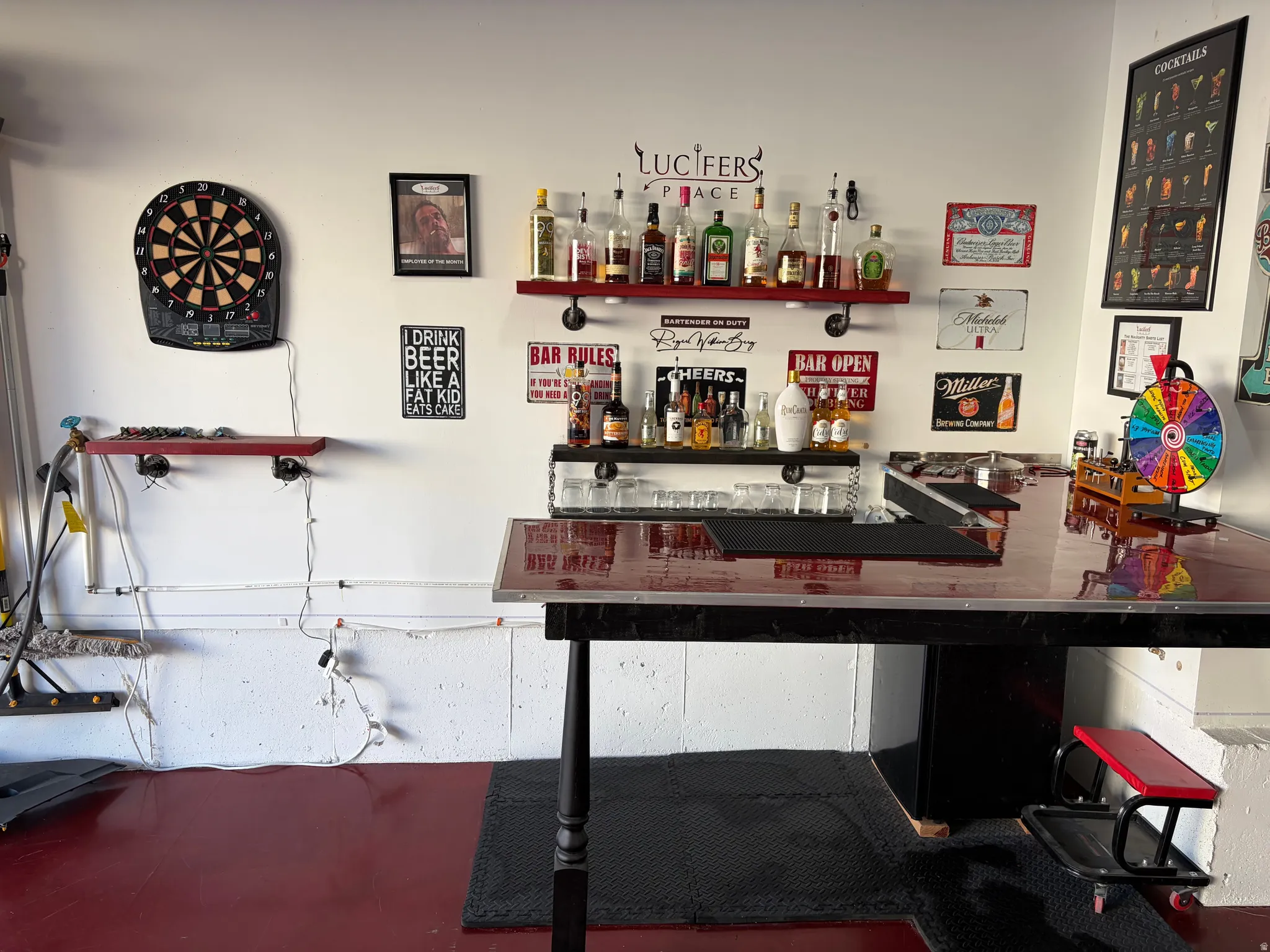 Garage by Day.  Party by Night!  Flip Up Convertible Bar, Mini Fridge, Pac Man Video Arcade Game, 60" TV, Dart Board, Removable Dance/Fitness Pole, Custom Flip Up Bench Seating, Lights, Speakers, Storage Cabinets and Decor, plus an EV Plug and Mounted Ret