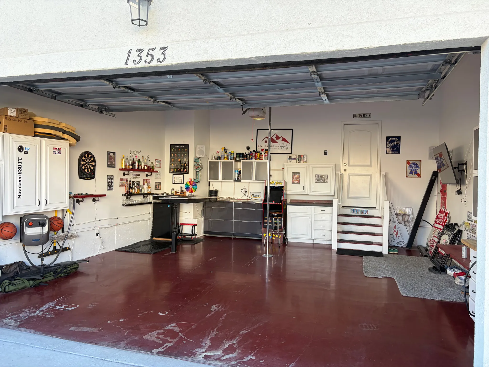 Garage by Day.  Party by Night!  Flip Up Convertible Bar, Mini Fridge, Pac Man Video Arcade Game, 60" TV, Dart Board, Removable Dance/Fitness Pole, Custom Flip Up Bench Seating, Lights, Speakers, Storage Cabinets and Decor, plus an EV Plug and Mounted Ret