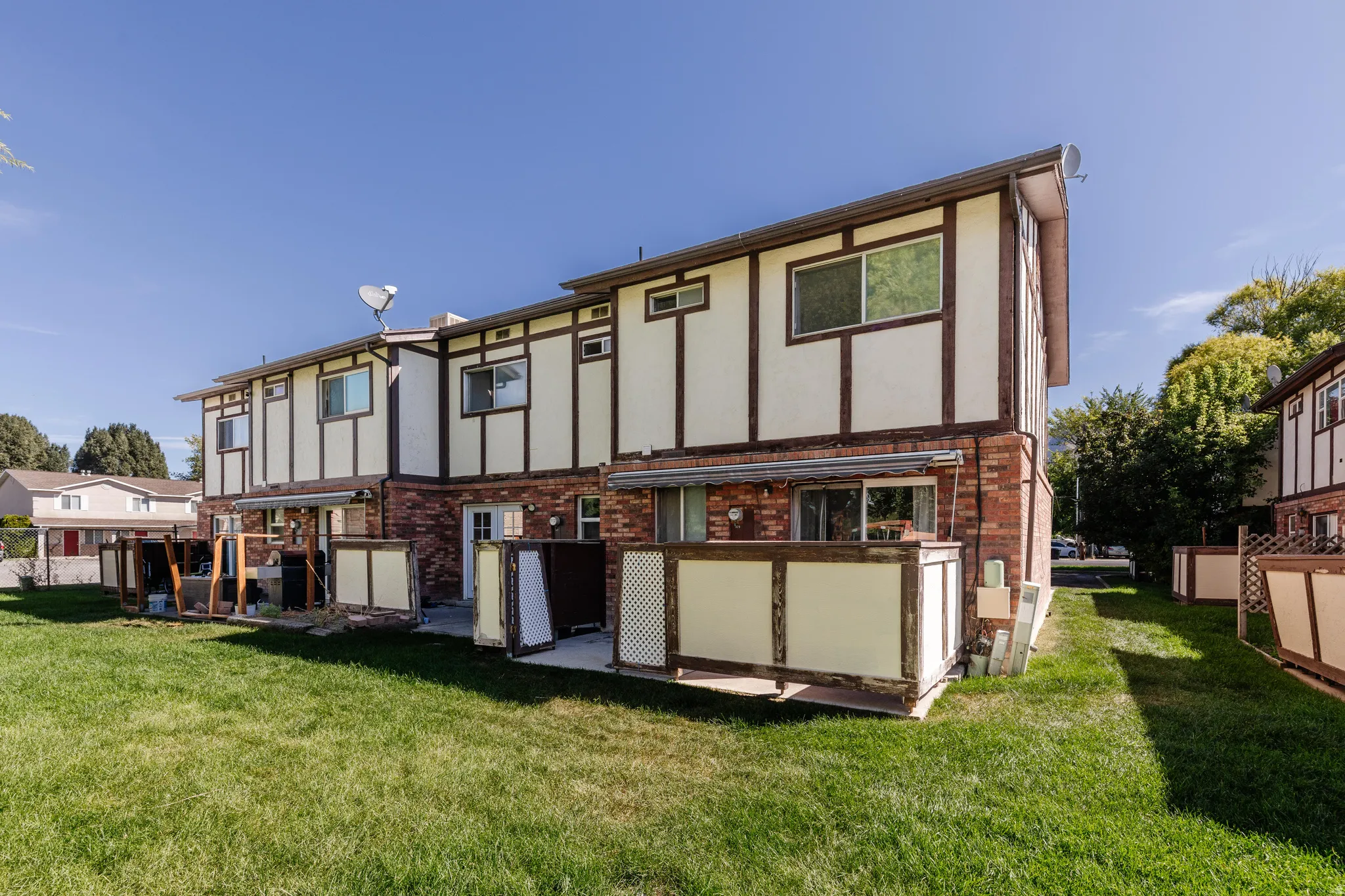 Brick and siding exterior with wood trim accents