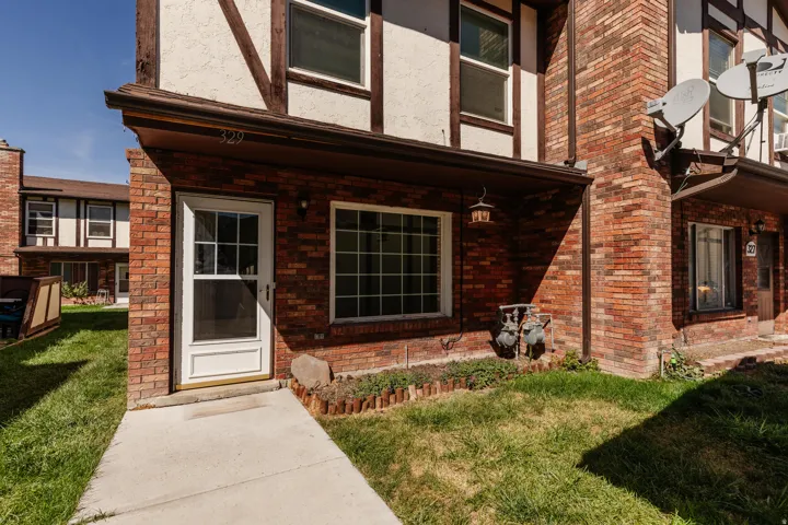 Brick and stucco exterior with dark timber accents