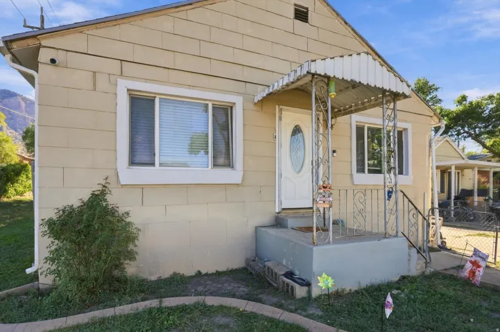 Light-colored exterior siding with white trim