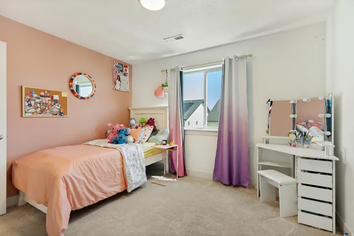 White framed window with privacy curtains, recessed lighting, and soft carpeting