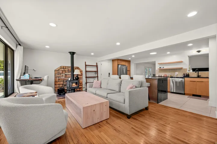 Wood-finish flooring throughout, complemented by recessed lighting