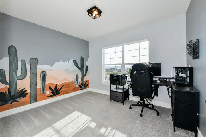 Recessed lighting fixture, light gray carpeting, neutral wall color, painted accent wall, and a large multi-pane window
