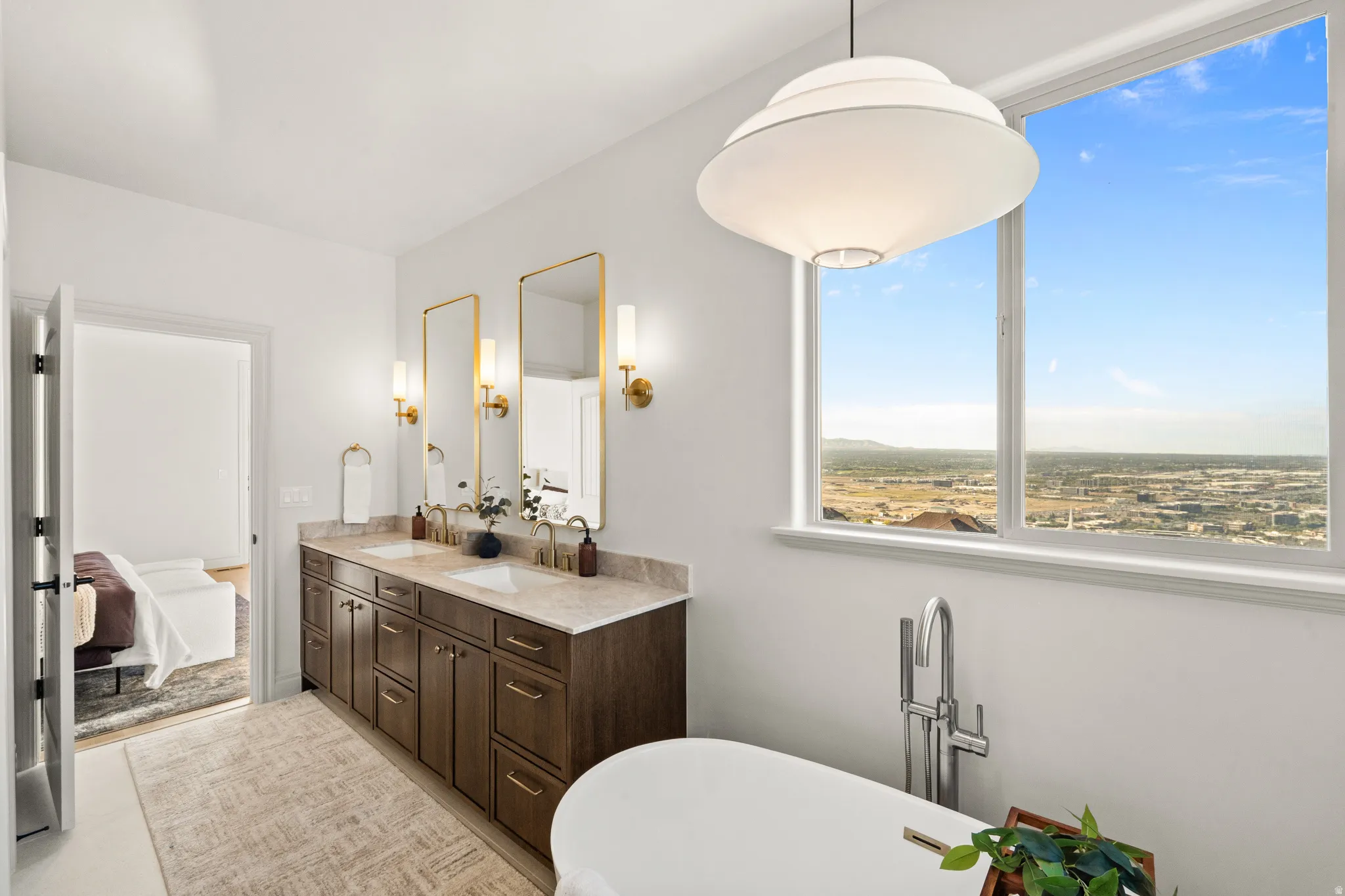Dual vanity with wood cabinetry and stone countertops