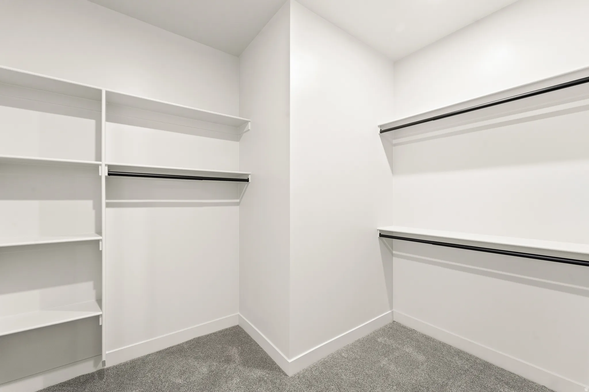 Wall-to-wall carpeting and white walls