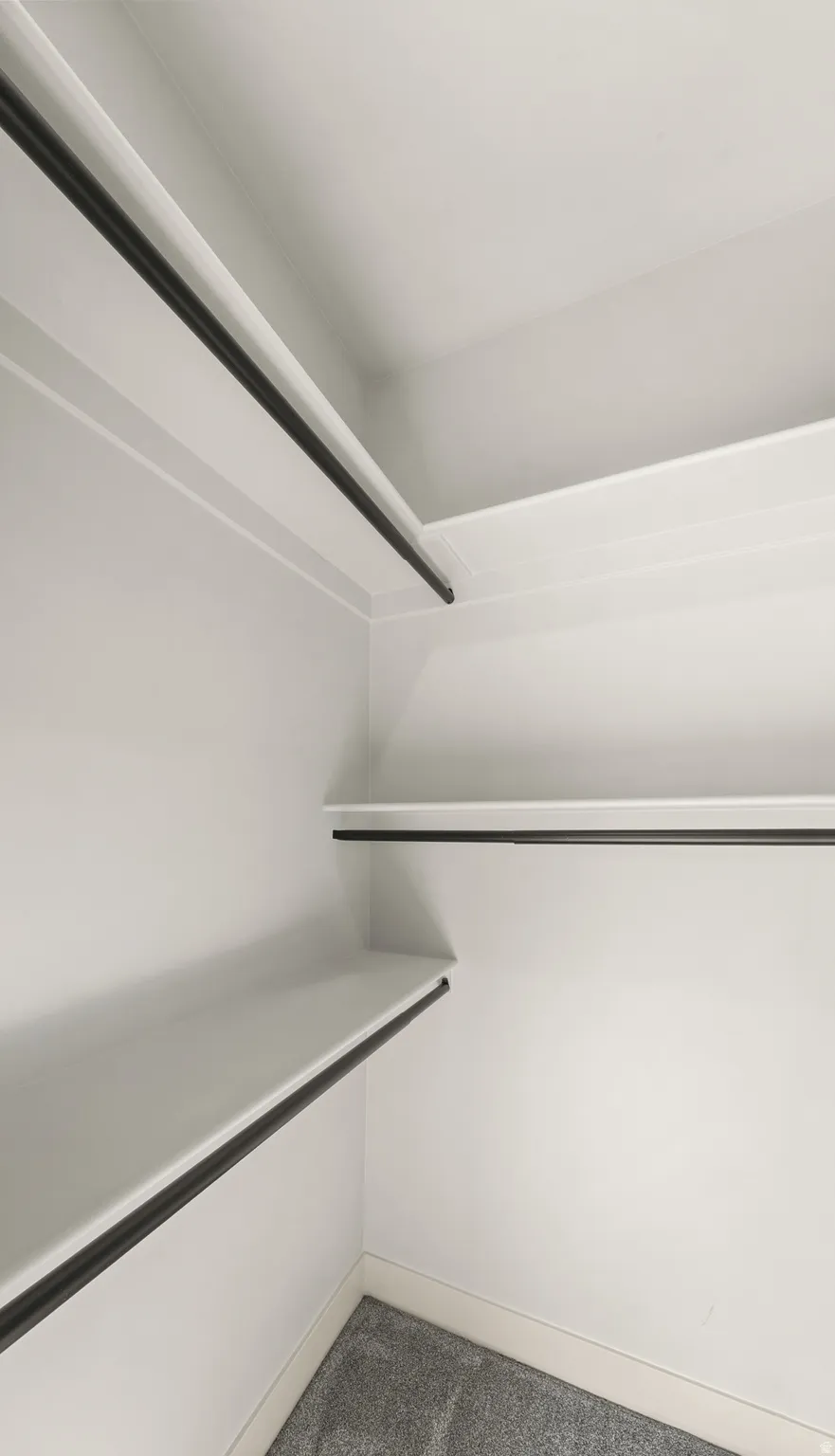 White shelving with integrated hanging rods