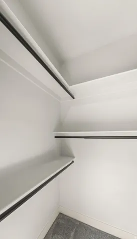 White shelving with integrated hanging rods