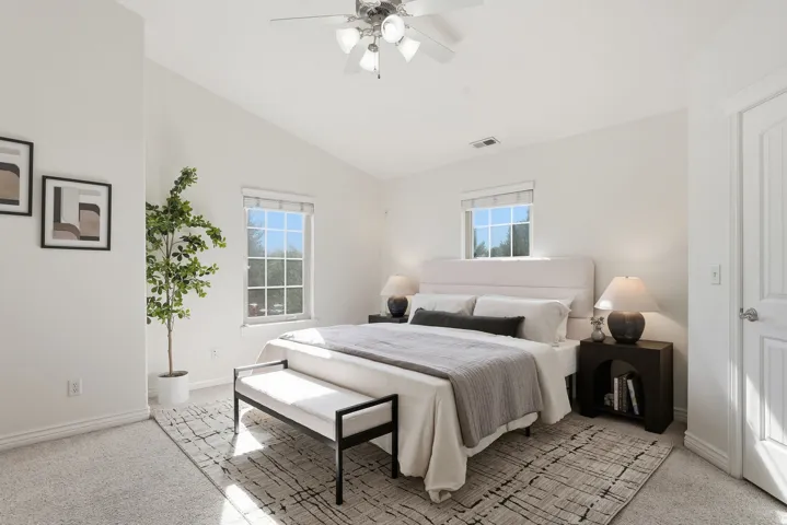 Primary bedroom with bathroom and walk in closet