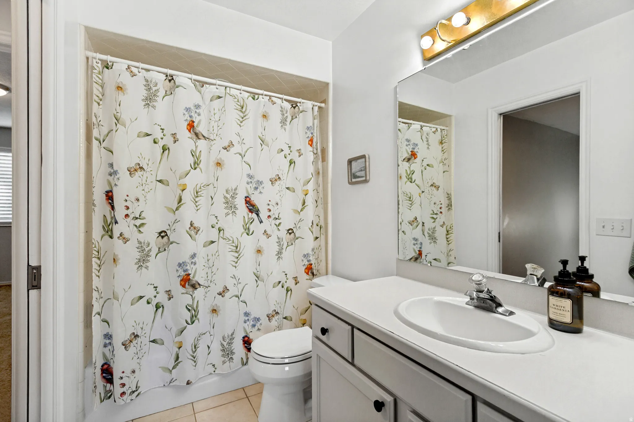 White vanity with an integrated sink and chrome faucet