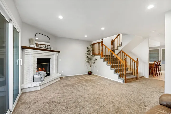 Brick fireplace with a wood mantel