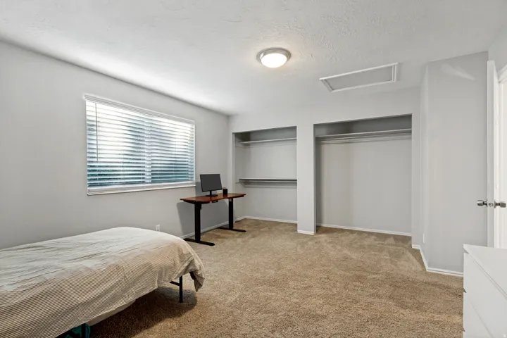 Recessed open closets with shelving and hanging rods