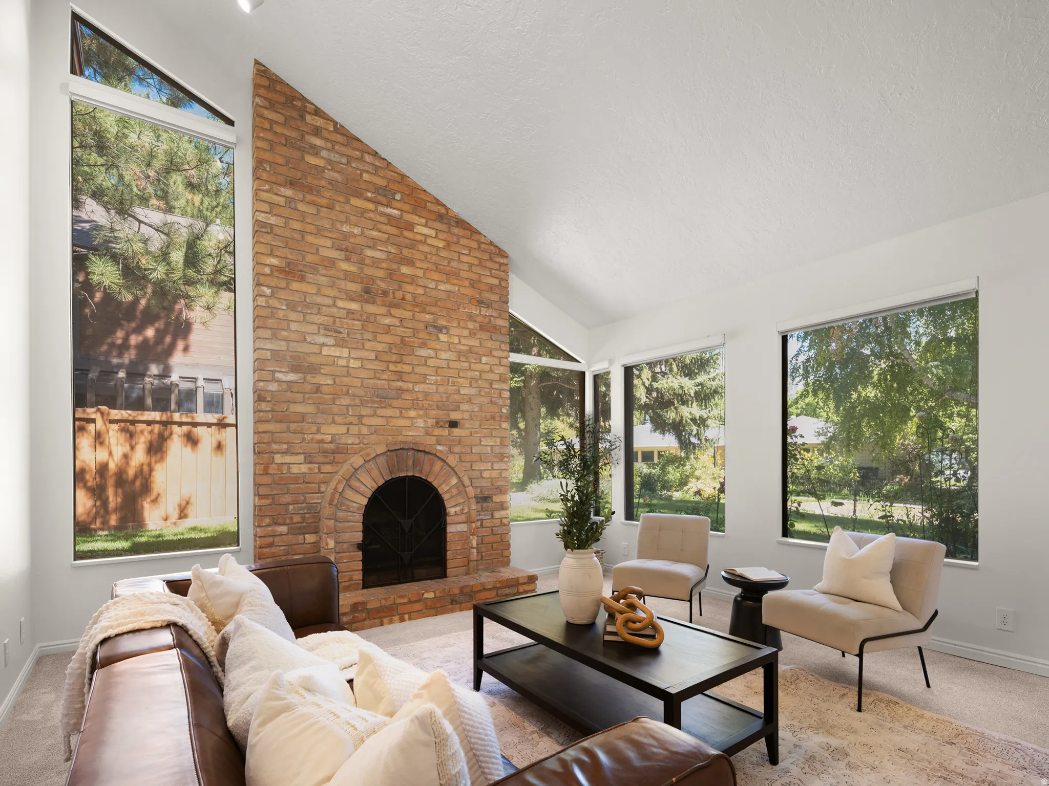 Family room has beautiful brick fireplace