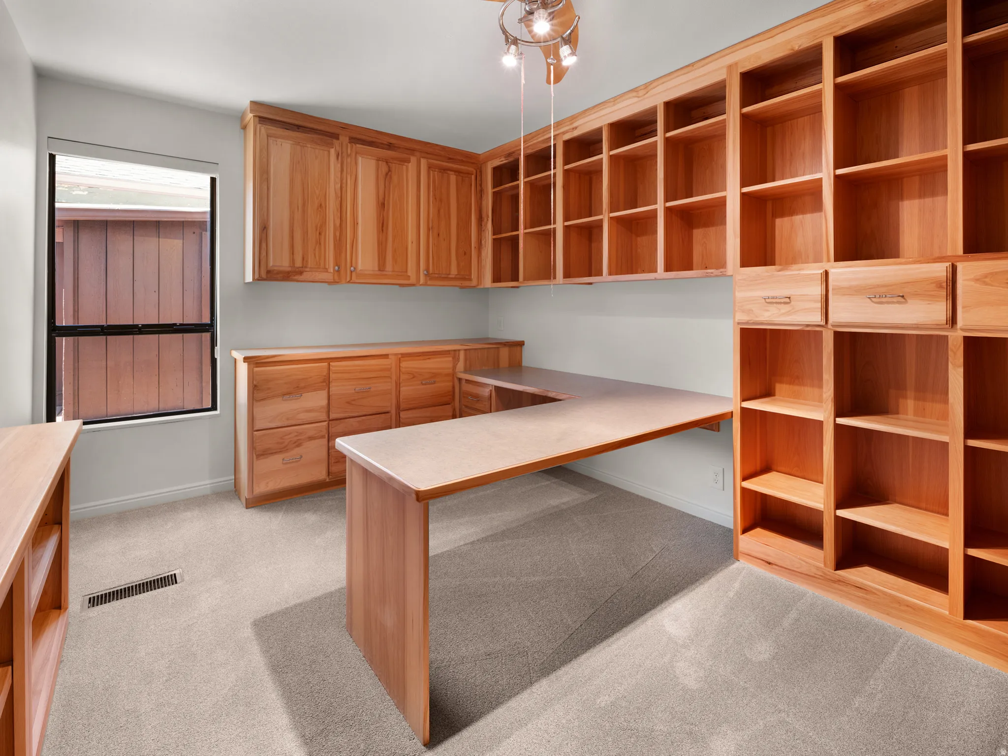 Bedroom #2 is currently used as an office with hickory cabinetry