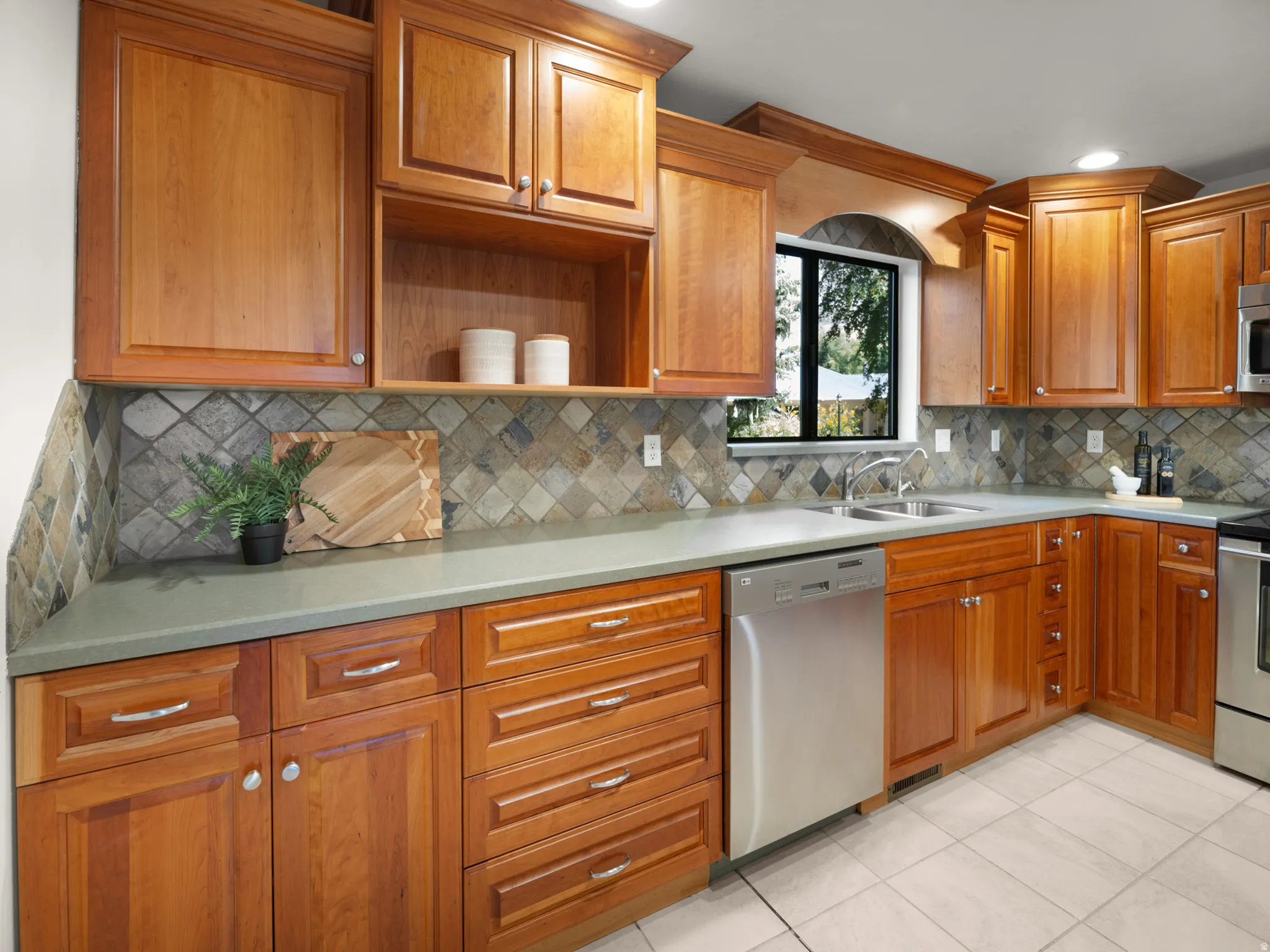 Completely remodeled kitchen has a beautiful backsplash