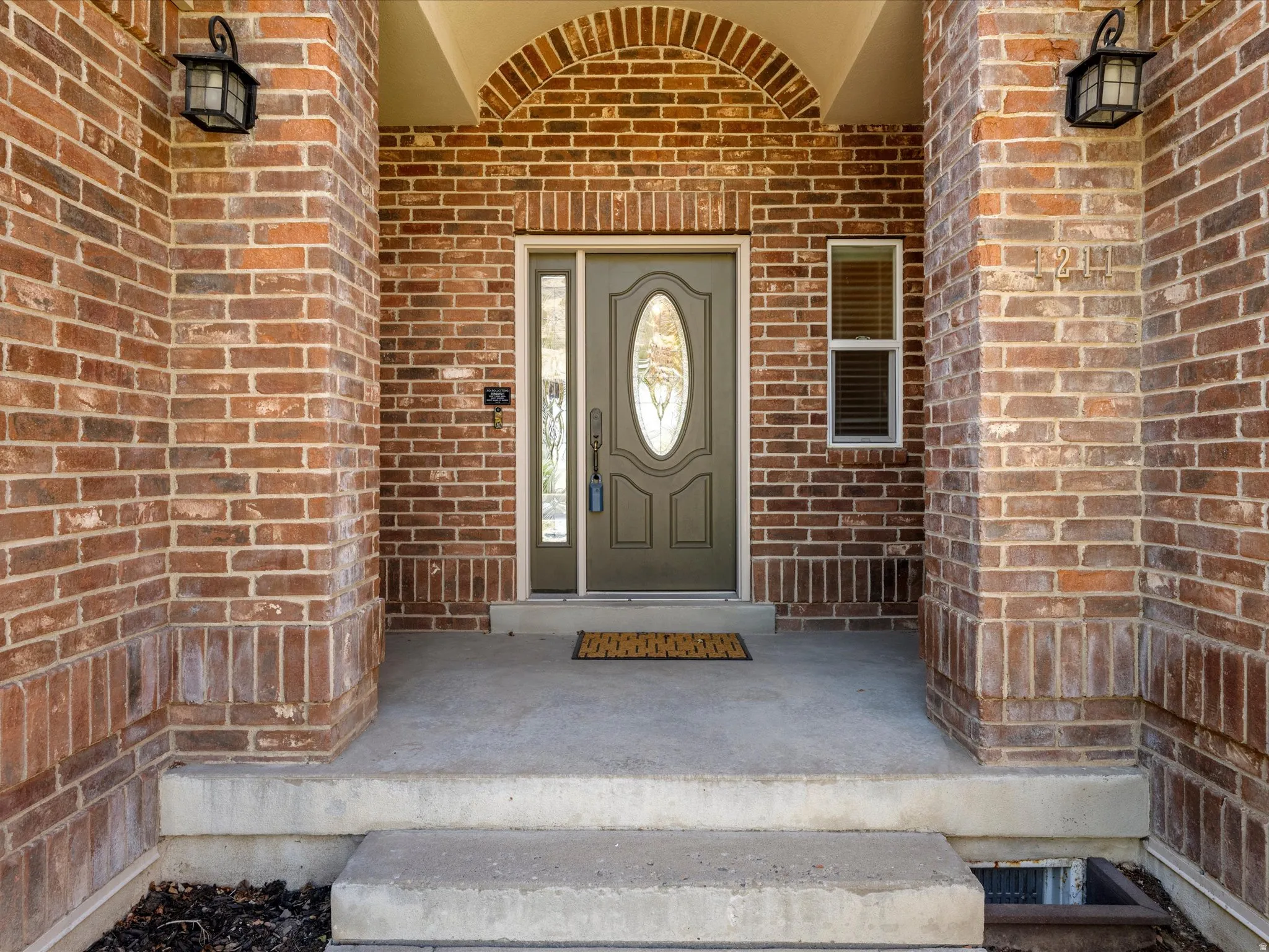 Brick exterior with an arched entryway