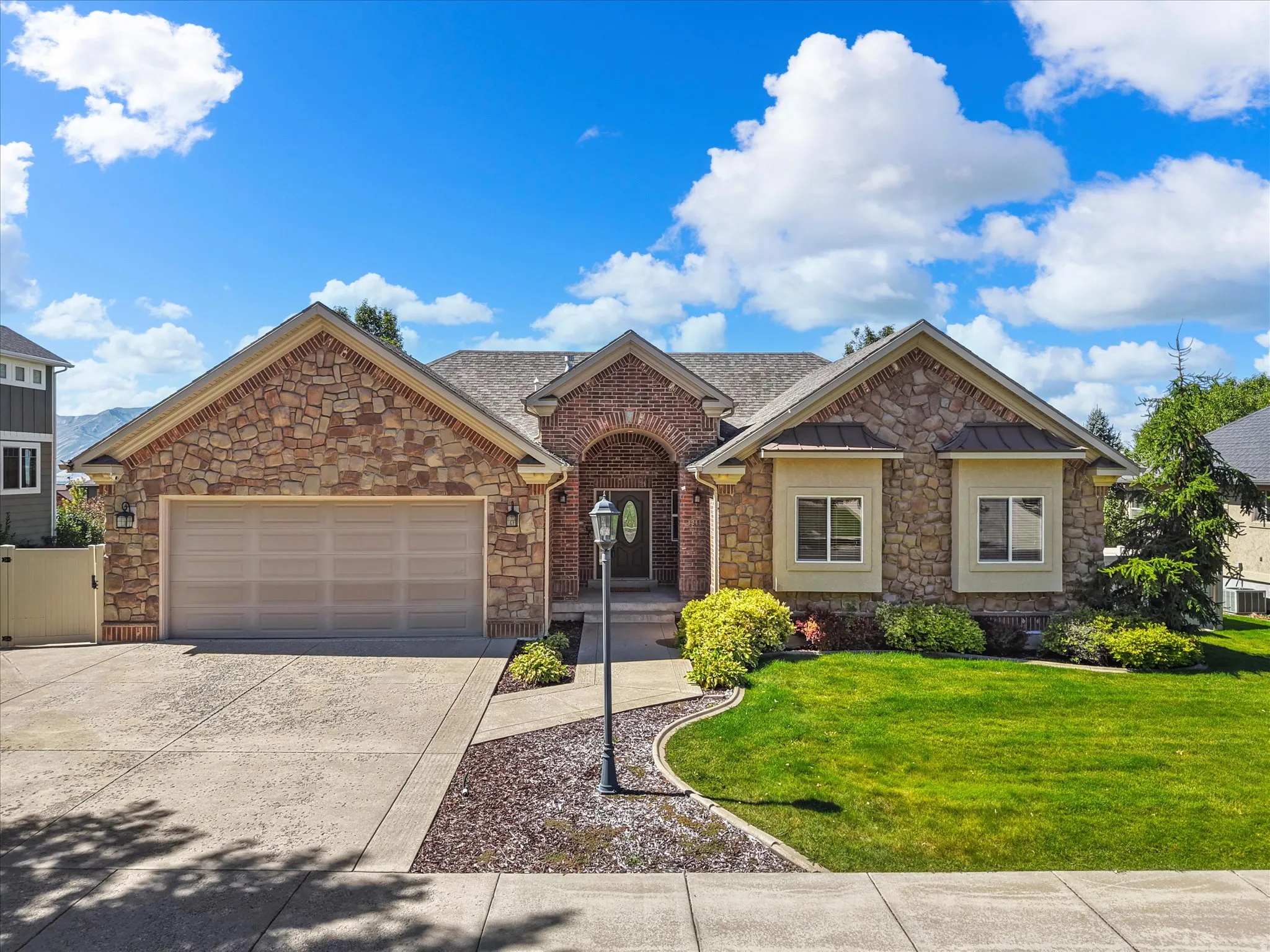 Stone and brick exterior with a prominent arched entry
