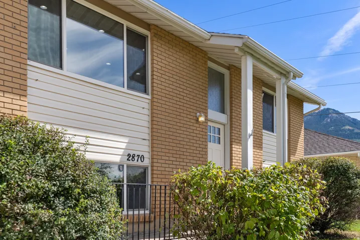 Brick and siding exterior with a covered entry