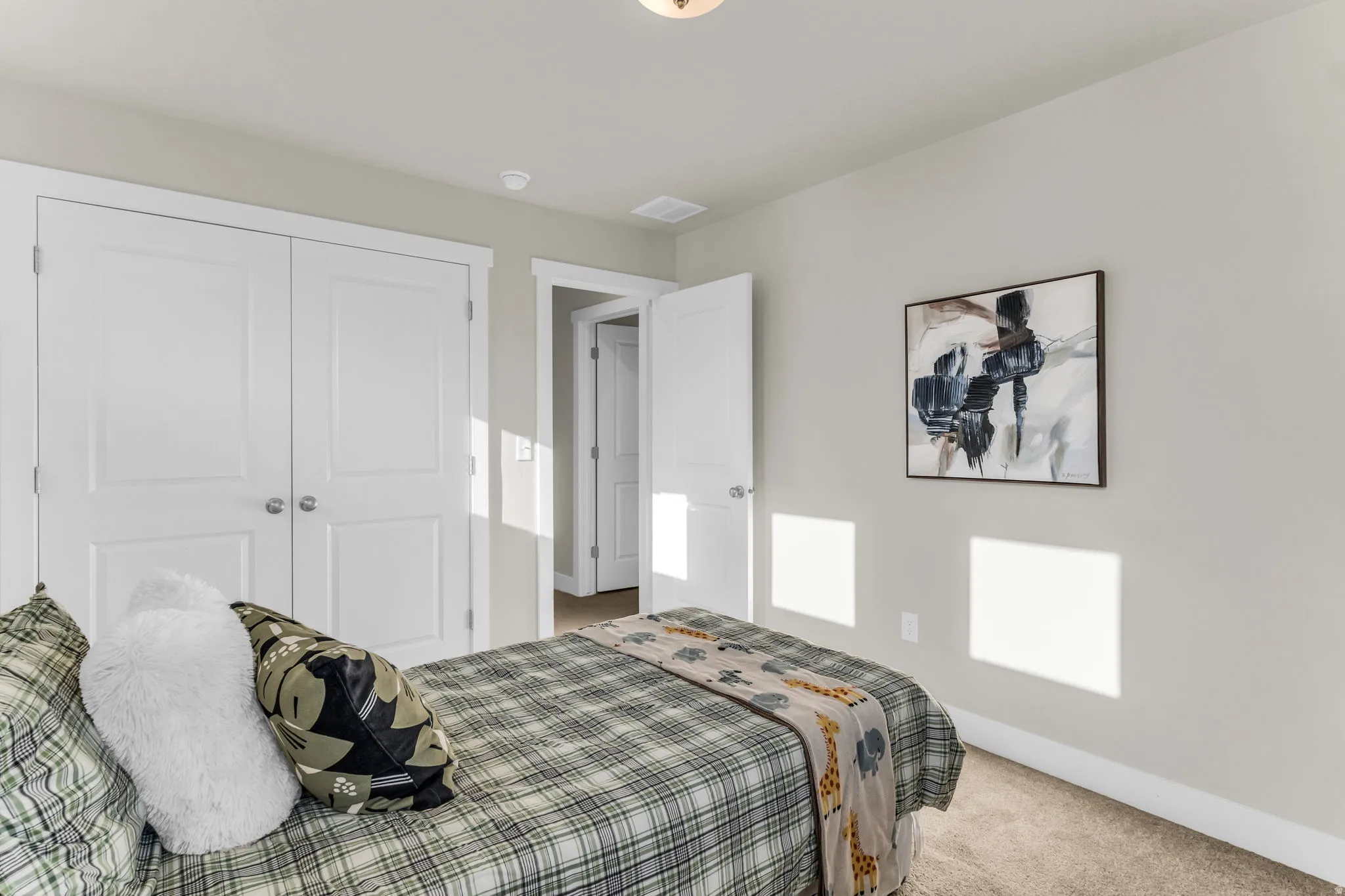 Recessed ceiling lighting, panel doors with brushed nickel hardware, and neutral wall tones
