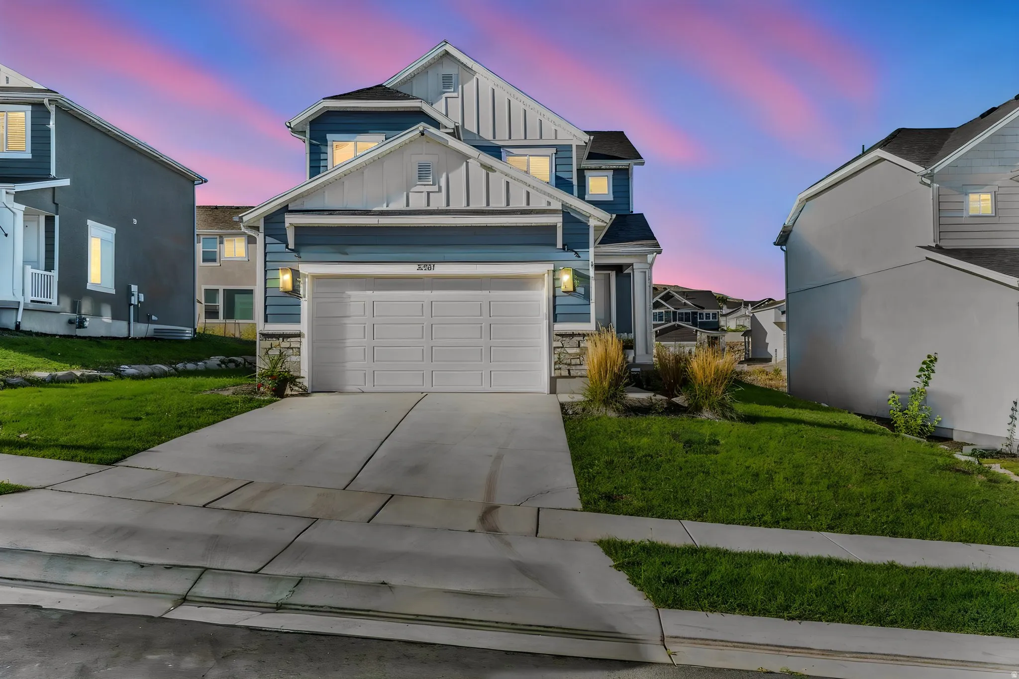 Two-story residence with blue siding and white trim accents