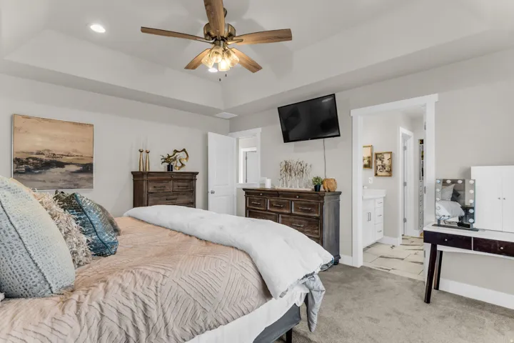 Tray ceiling with recessed lighting and a ceiling fan
