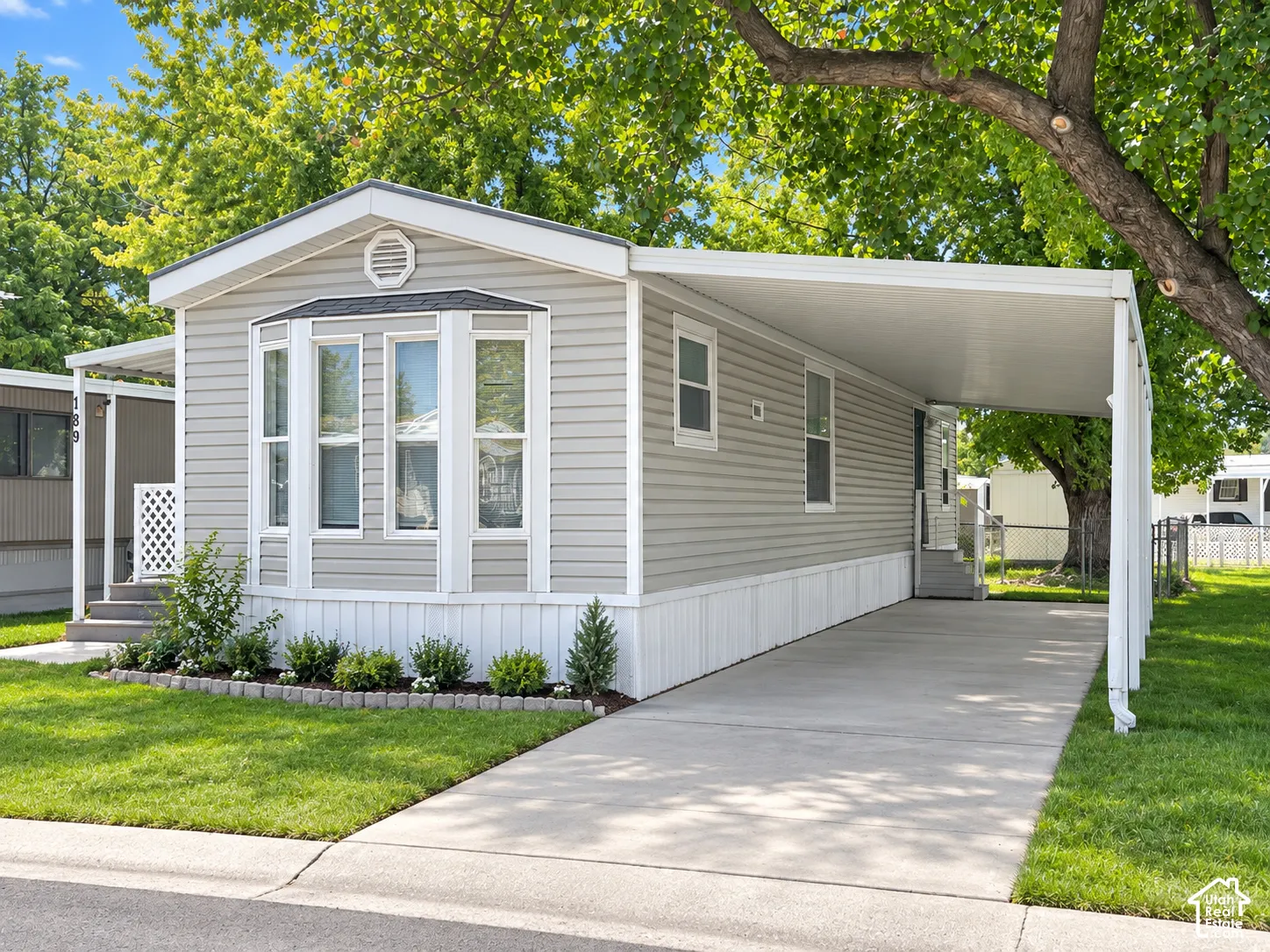 Light gray siding exterior with a white trim package