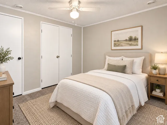 Carpeted flooring, ceiling fan with integrated lighting, two panel doors, and neutral wall tones