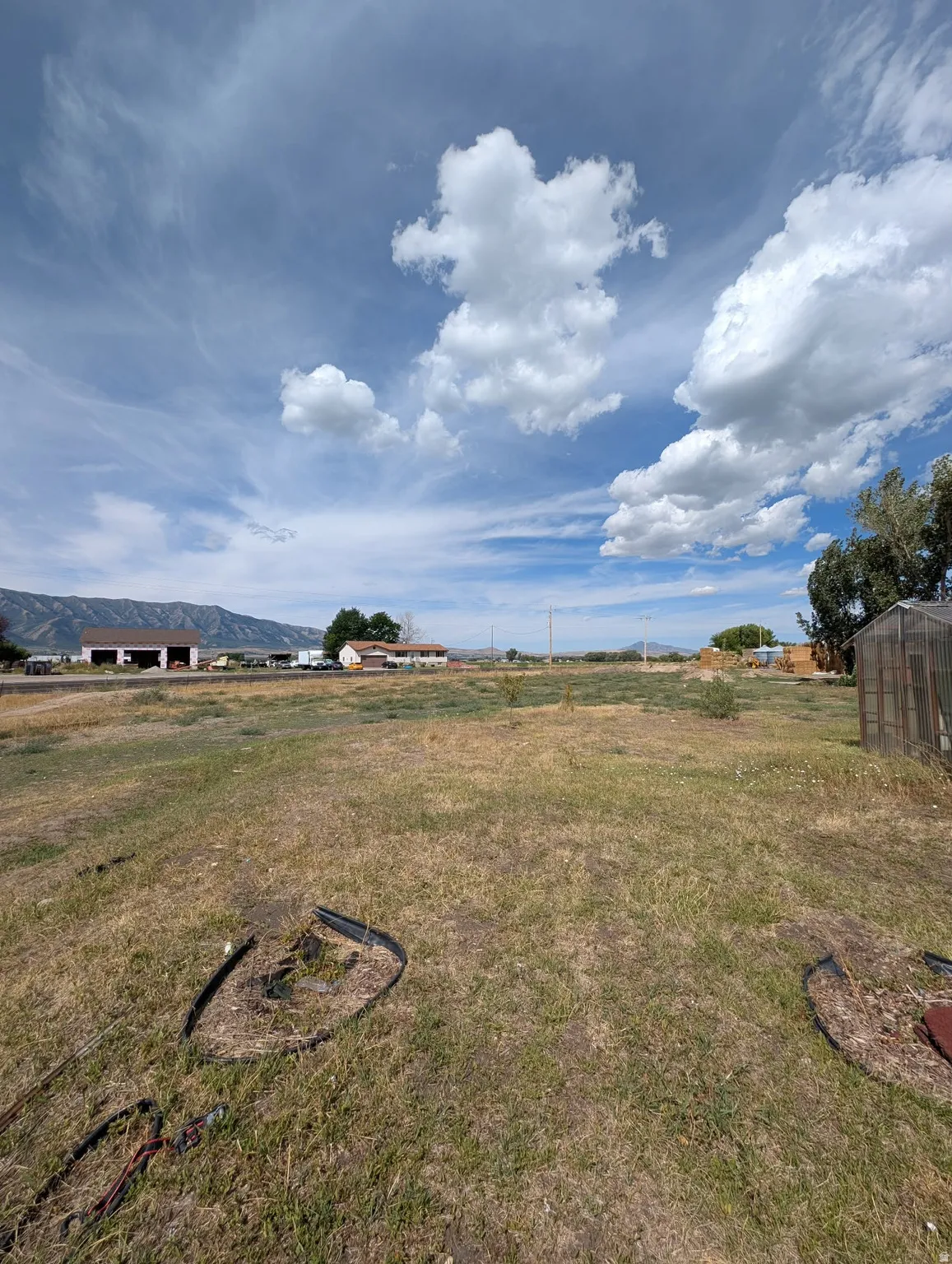 Expansive open lot with distant mountain scenery