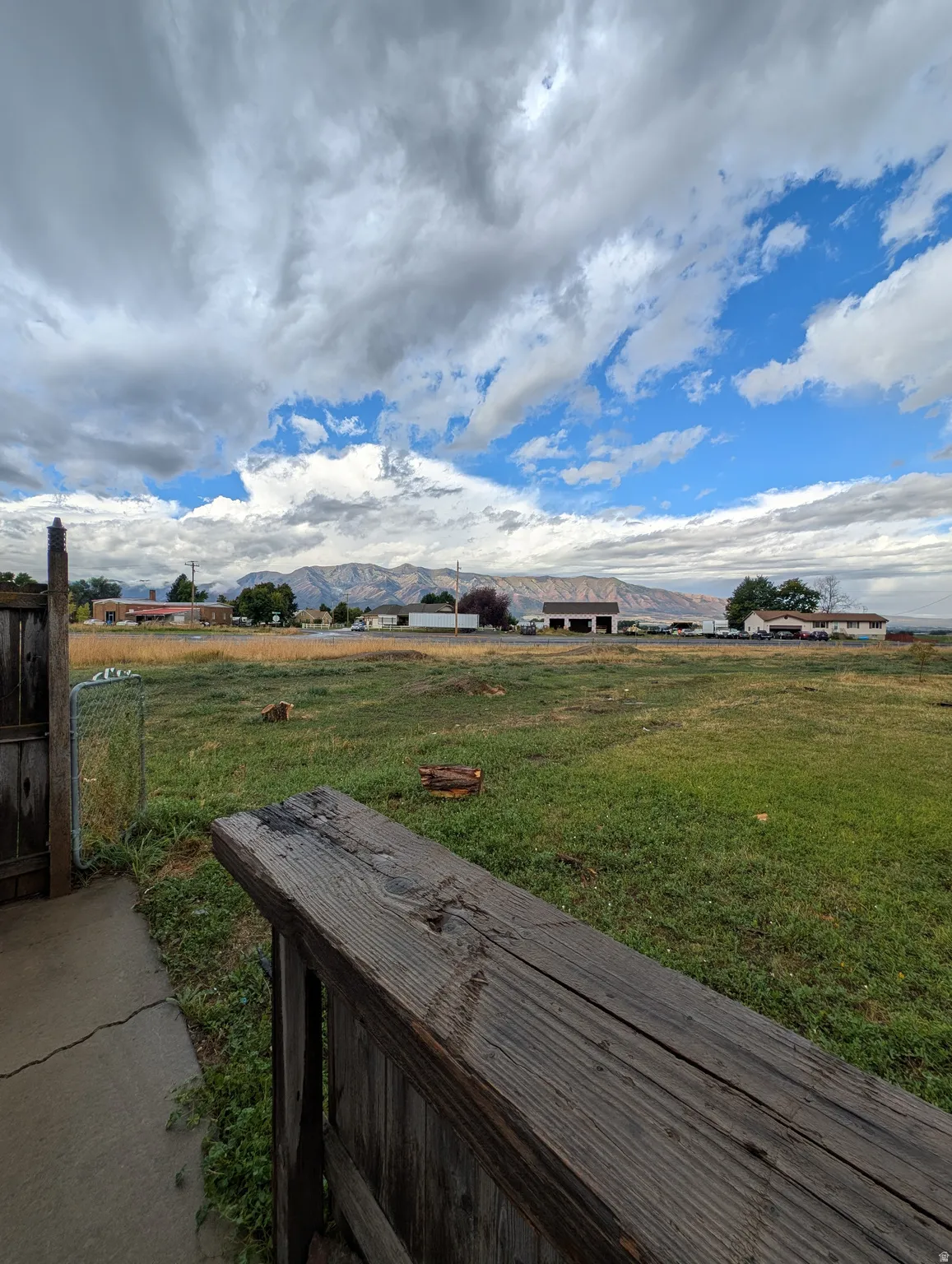Expansive open lot with a mountain backdrop