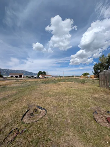 Expansive open lot with distant mountain scenery