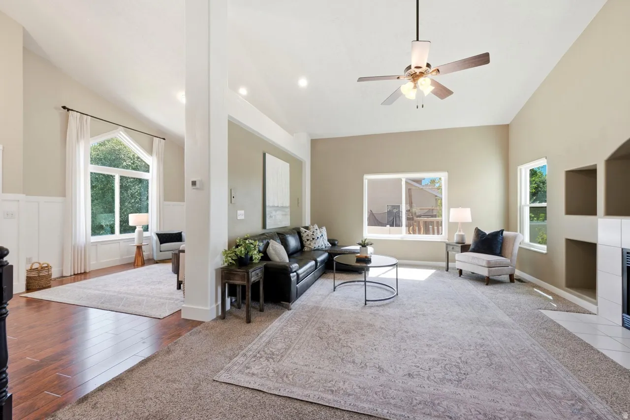 Vaulted ceilings, recessed lighting, ceiling fan, and built-in shelving