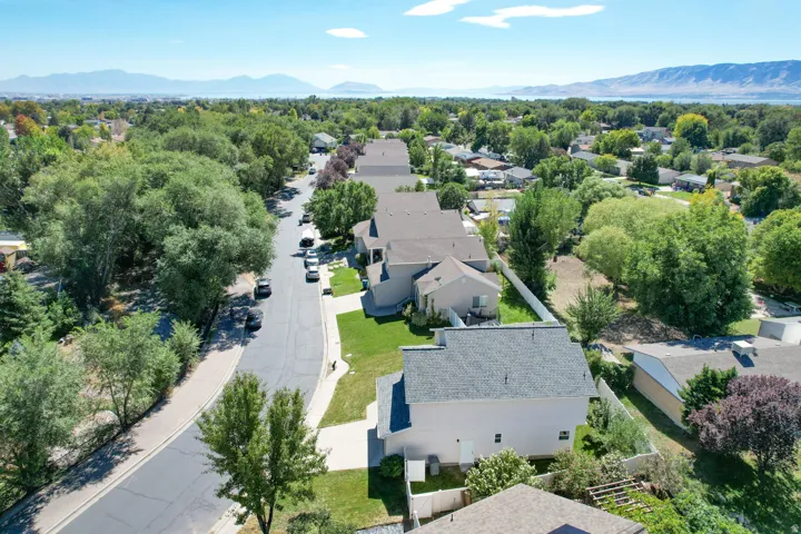 Mountain and water backdrops, tree-lined streets, and residential architecture