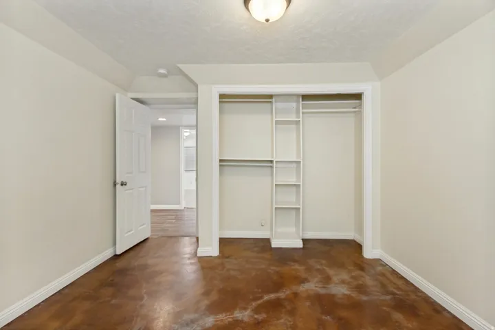 Integrated closet shelving with hanging rods and built-in vertical storage